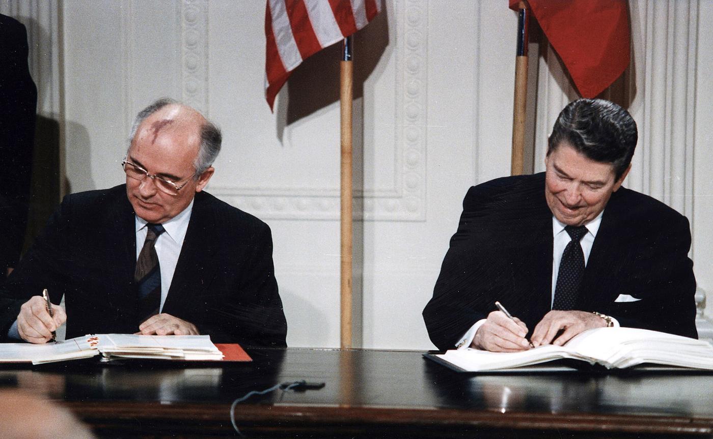 US President Reagan and Soviet leader Mikhail Gorbachev sign the Intermediate-Range Nuclear Forces Treaty, in which their two nations agree to eliminate their stocks of intermediate-range and shorter-range (or “medium-range”) land-based missiles, 8 December 1987. © The White House
)