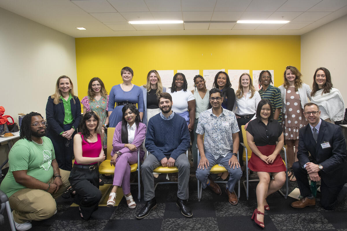 A group photo of 18 people. 