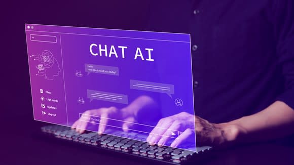 Using an AI chatbot on a laptop computer.