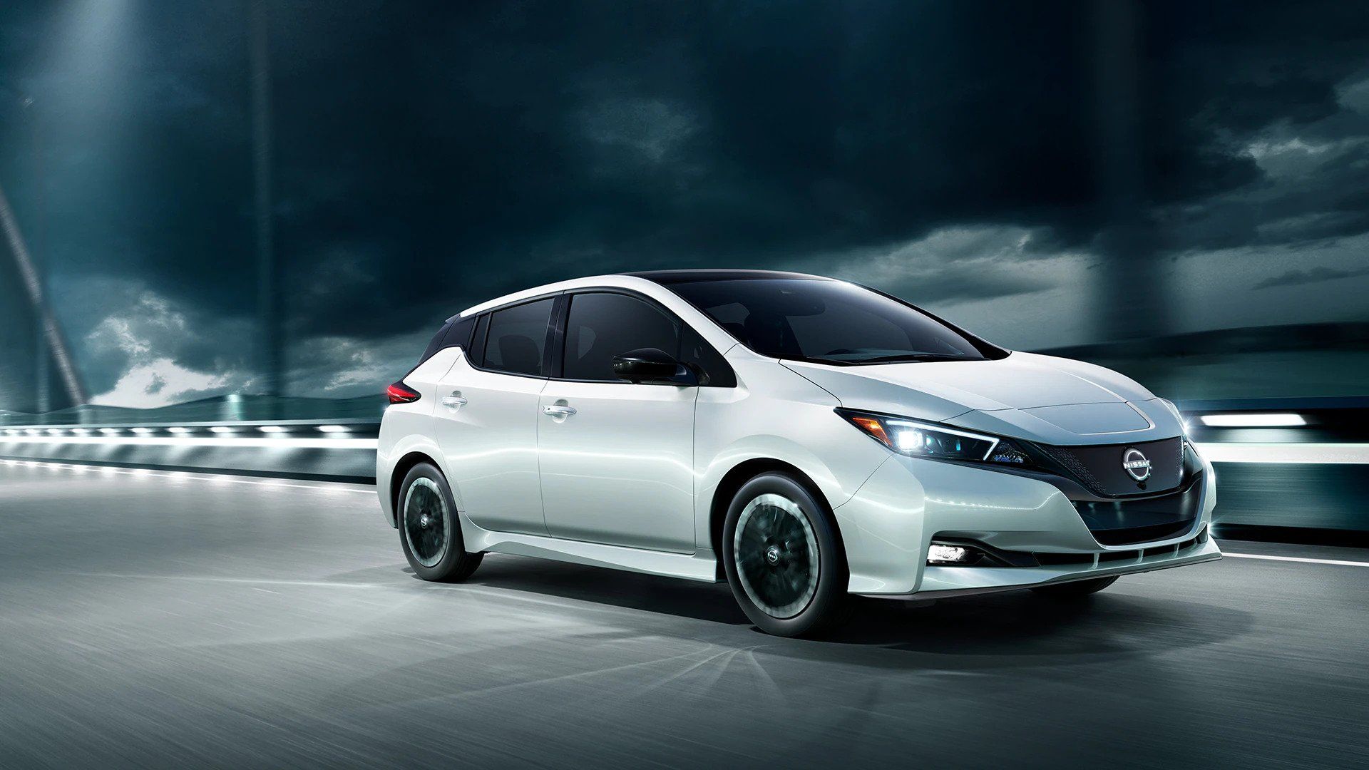 White 2024 Nissan Leaf driving