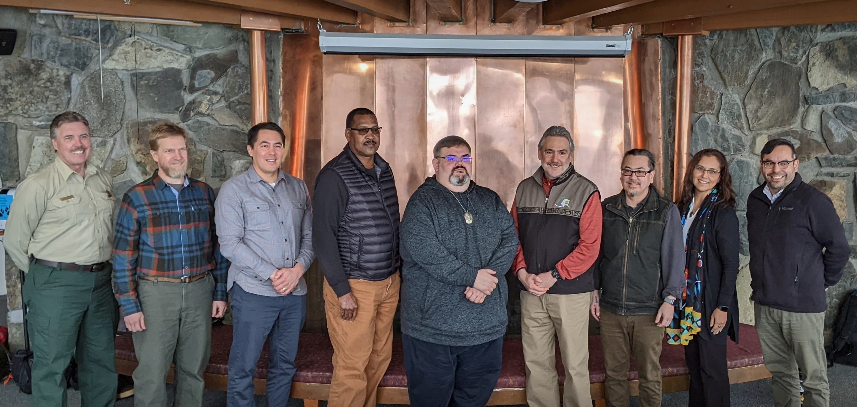 Leaders from D.C. and Alaska pose for a photo in the Mendenhall Glacier Visitor Center.