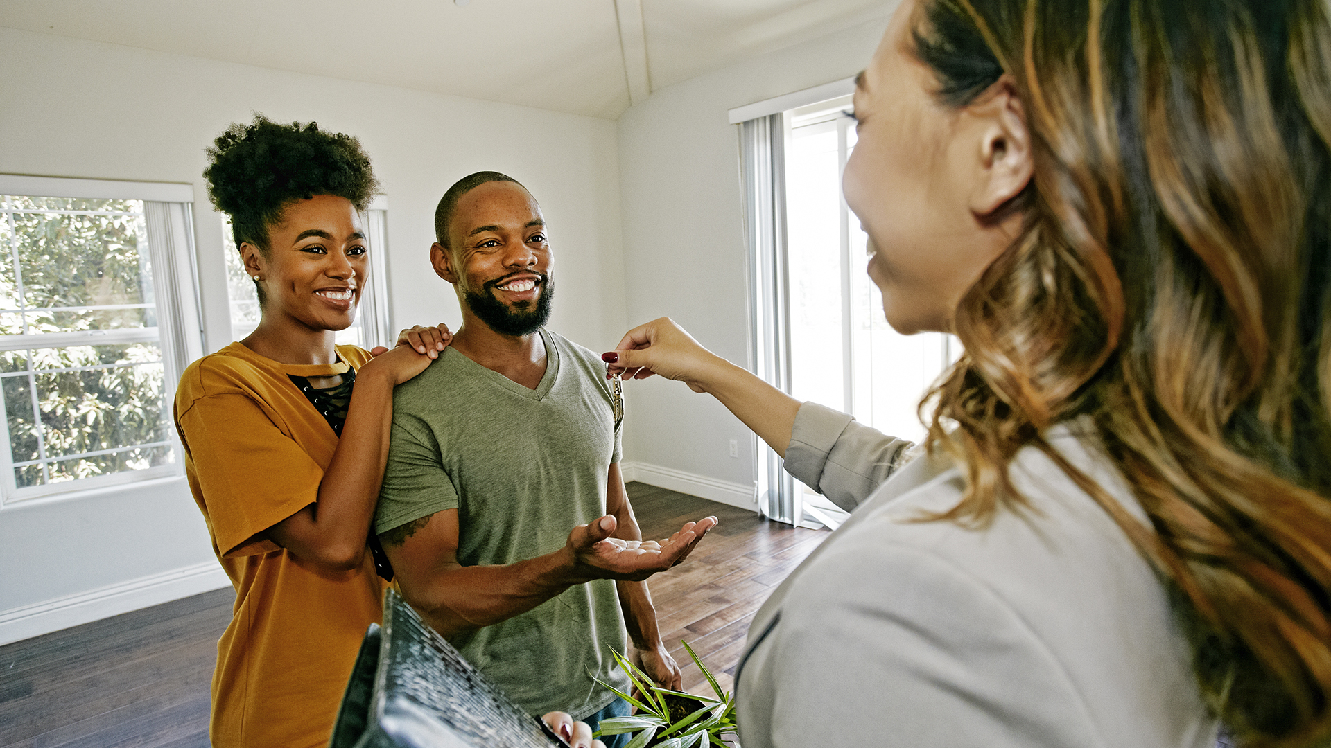 real estate agent handing over the keys to a new home