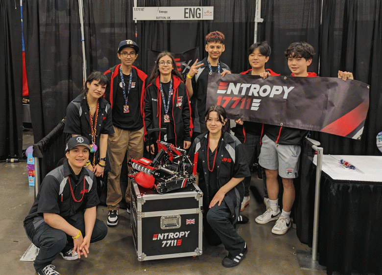 Delta High Robotics Team members wearing their red, gray and black uniforms show off their entry. (Courtesy photo)