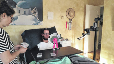 Students test their robotic interface, living with a man with quadriplegia