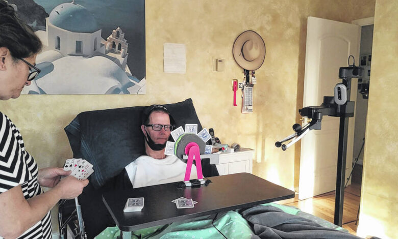 Students test their robotic interface, living with a man with quadriplegia Students test their robotic interface, living with a man with quadriplegia