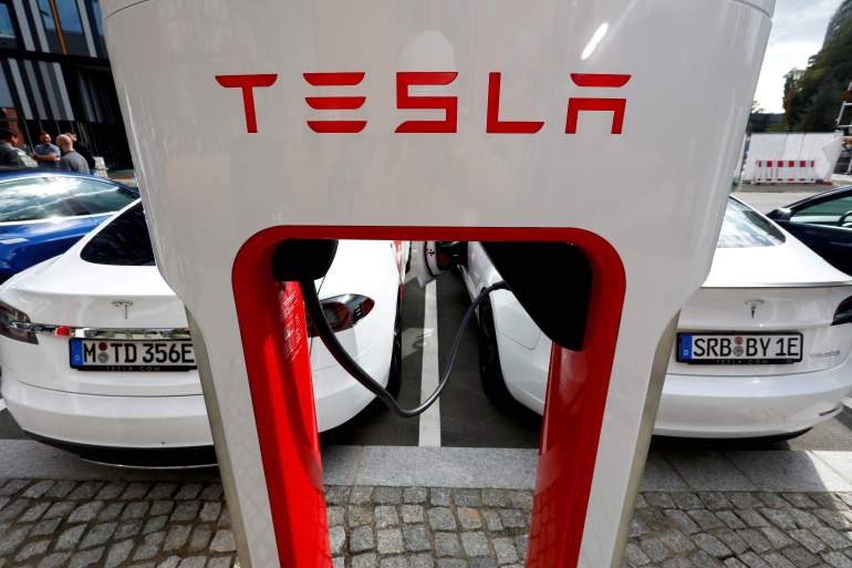 The company logo of Tesla cars is seen on the V3 supercharger equipment in Berlin, Germany