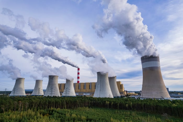 A nuclear power plant in a field.