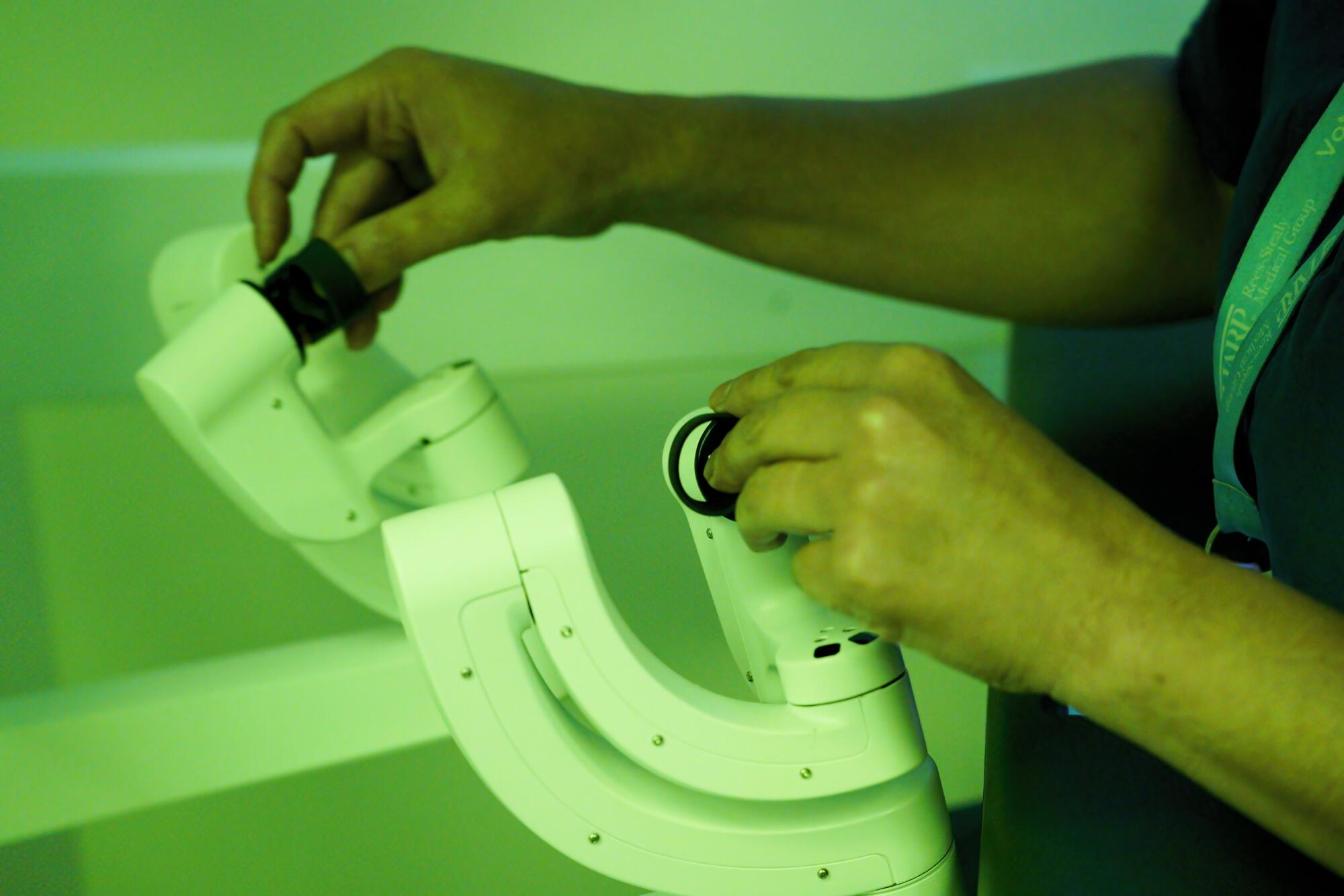 Pamela Lee, MD, works from the surgeon console where she controls the robotic surgical procedure on her patient.