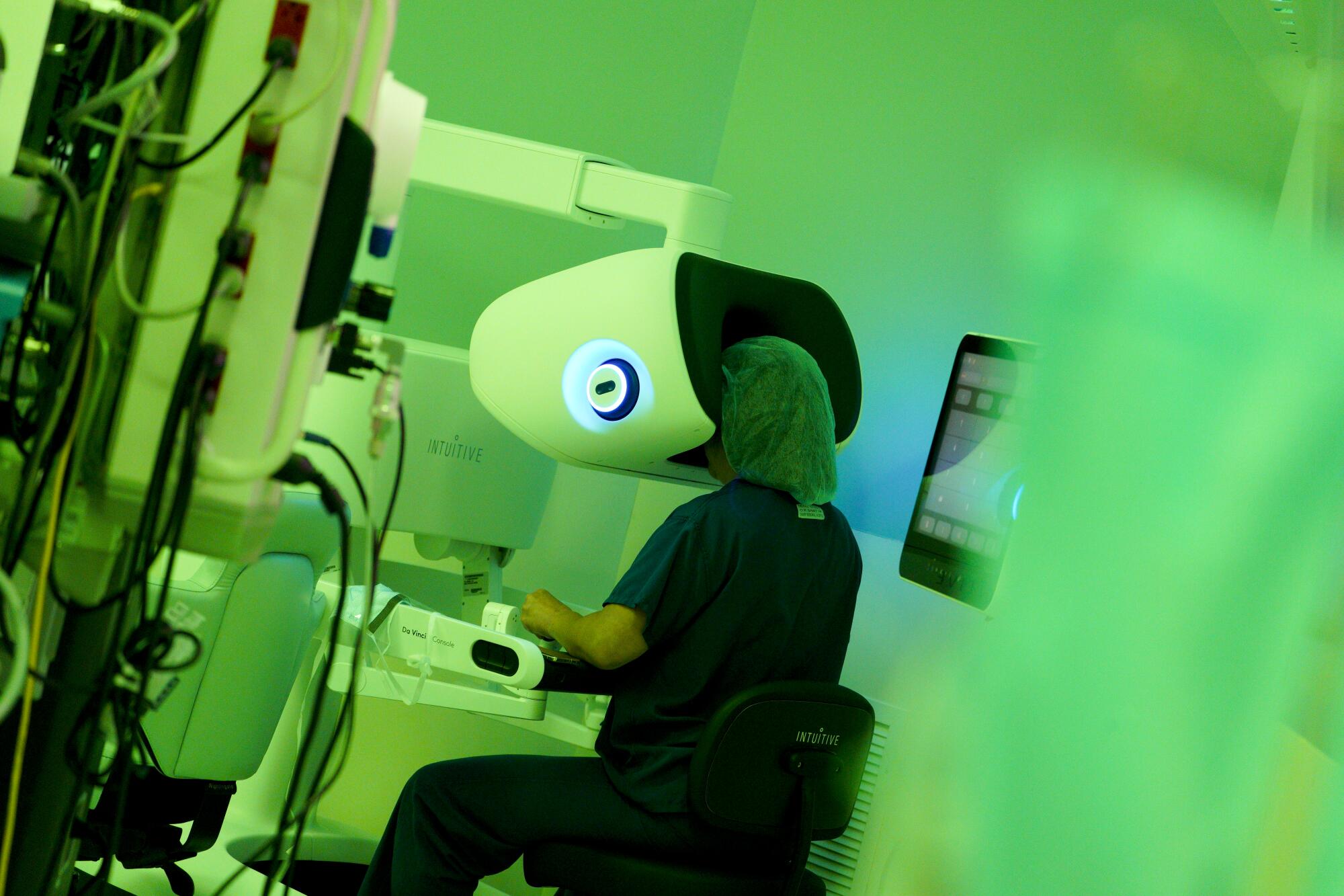 Pamela Lee, MD, works from the surgeon console where she controls the robotic surgical procedure on her patient.