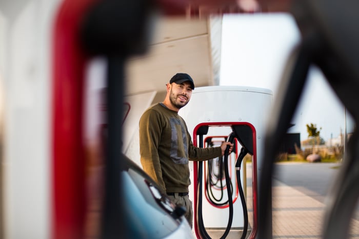 A person charging their electric vehicle.