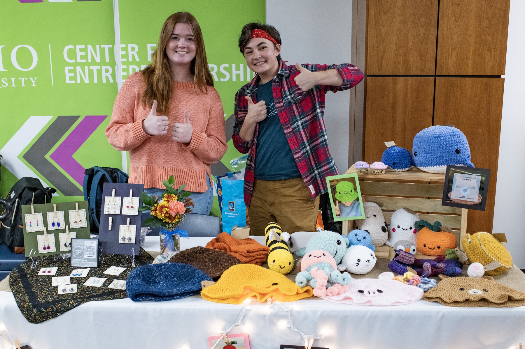 Two OHIO students are shown at their booth at the StartUp Market