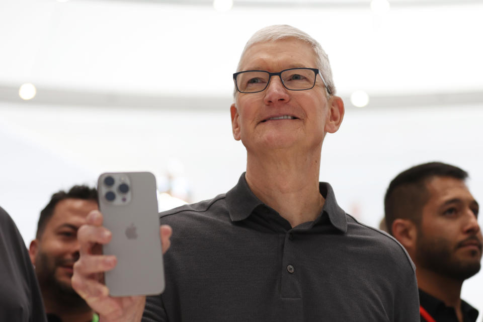 CUPERTINO, CALIFORNIA - SEPTEMBER 12:  Apple CEO Tim Cook holds up a new iPhone 15 Pro during an Apple event on September 12, 2023 in Cupertino, California. Apple revealed its lineup of the latest iPhone 15 versions as well as other product upgrades during the event. (Photo by Justin Sullivan/Getty Images)