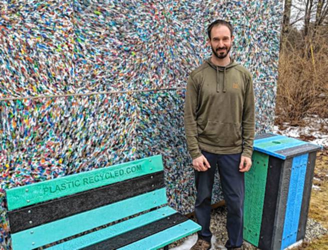 Nathan Gray standing with products made with the chips.