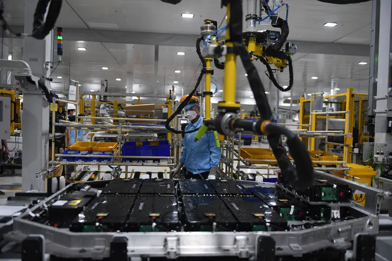 a worker assembles an electric car battery inside the battery pack shop at the electric automobile plant of vinfast in haiphong on april 7, 2022 photo by nhac nguyen afp photo by nhac nguyenafp via getty images