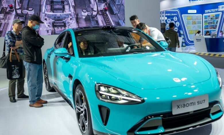 China’s EV Makers Battle for Market Dominance With Smart Features China’s EV Makers Battle for Market Dominance With Smart Features