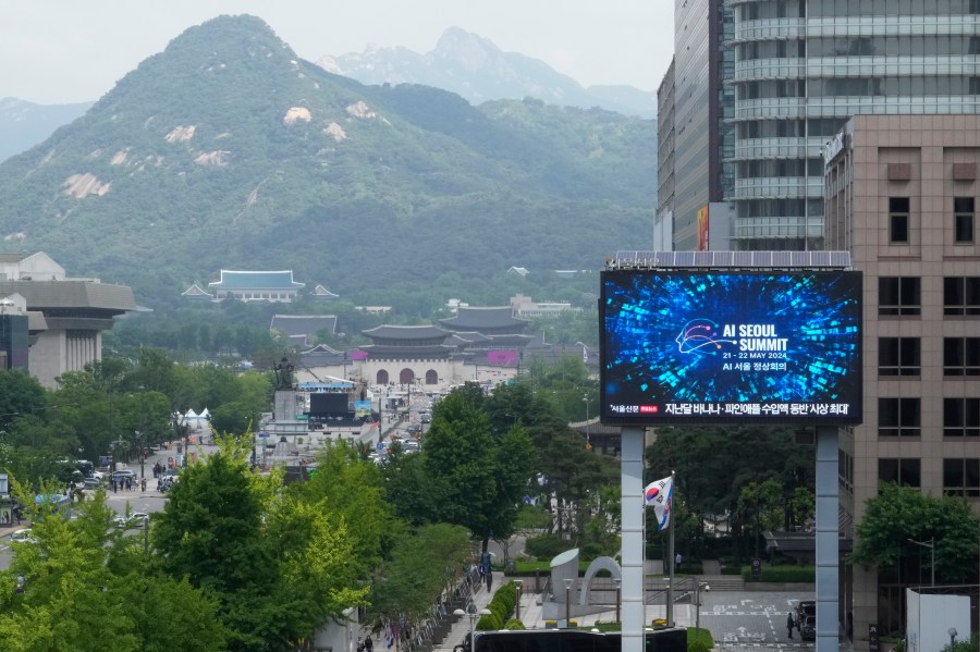 A screen shows an announcement of the AI Seoul Summit in Seoul, South Korea, Tuesday, May 21, 2024. World leaders are expected to adopt a new agreement on artificial intelligence when they gather virtually Tuesday to discuss AI’s potential risks but also ways to promote its benefits and innovation. (AP Photo/Ahn Young-joon)