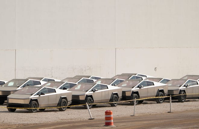 Cybertrucks are parked outside the Tesla Giga Texas factory on Thursday December 14, 2023.