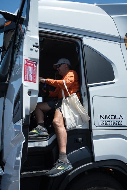 Brian Eberhart sits in the drivers seat of a Nikola Hydrogen Fuel Cell Electric Semi-truck on display at the Electrify Expo outside State Farm Stadium on May 4, 2024 in Glendale, Ariz.