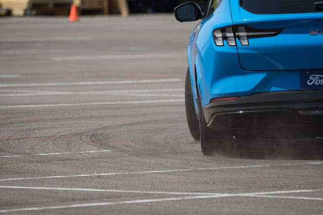 Fordâ€™s â€œHot Lapsâ€ take attendees on a fast, winding course as professionals drive them in the Mustang Mach-E electric SUV at the Electrify Expo outside State Farm Stadium on May 4, 2024 in Glendale, Ariz.