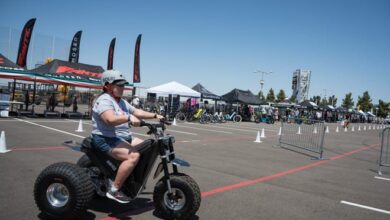 Visitors checked out electric vehicles at Electrify Expo