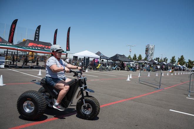 Visitors checked out electric vehicles at Electrify Expo Visitors checked out electric vehicles at Electrify Expo
