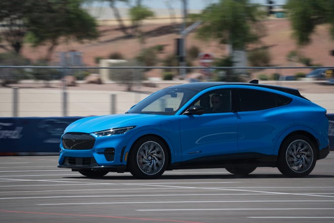 Fordâ€™s â€œHot Lapsâ€ take attendees on a fast, winding course as professionals drive them in the Mustang Mach-E electric SUV at the Electrify Expo outside State Farm Stadium on May 4, 2024 in Glendale, Ariz.