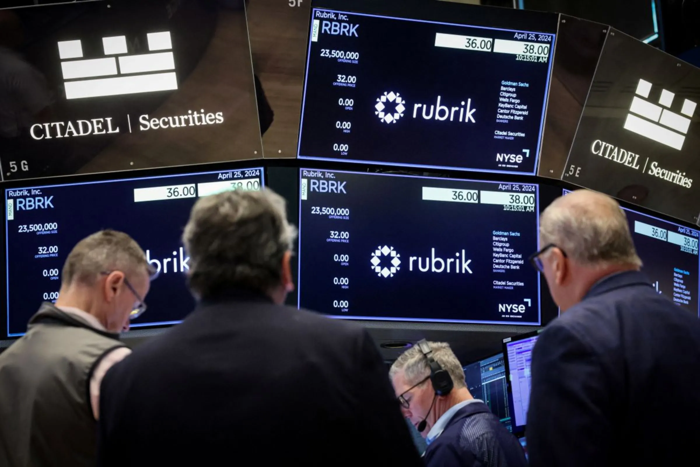 Traders gather at the post where Rubrik Inc., the Microsoft backed cybersecurity software startup, is traded at the New York Stock Exchange (NYSE) in New York City, U.S., April 25, 2024. REUTERS/Brendan McDermid