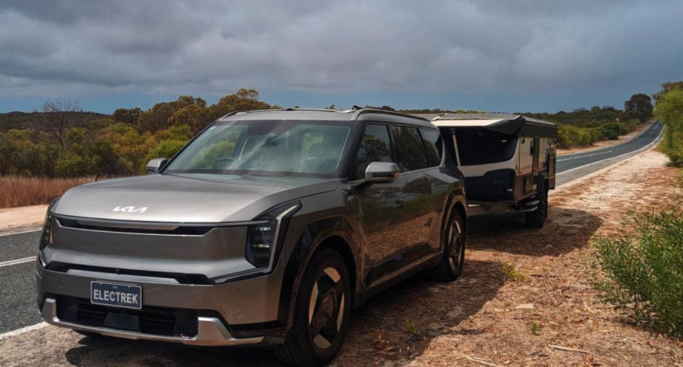 Tim and Renee McLennan's Kia EV9 with a two-tonne caravan, low-profile caravan on the back.