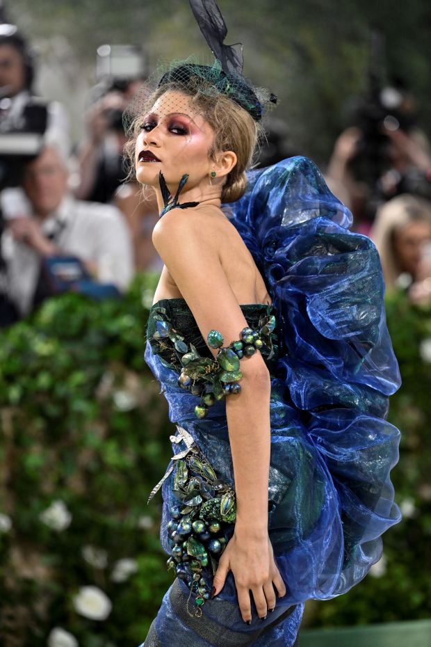 Zendaya poses in an elaborate gown at the 2024 MET Gala.