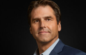 A portrait of Intuitive Surgical EVP and Chief Digital Officer Brian Miller.