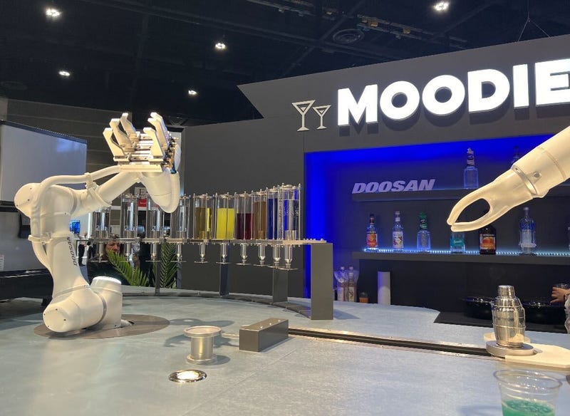 Doosan Robotics' robot barista, Moodie, analyzes a customer's mood and creates a custom cocktail for them.