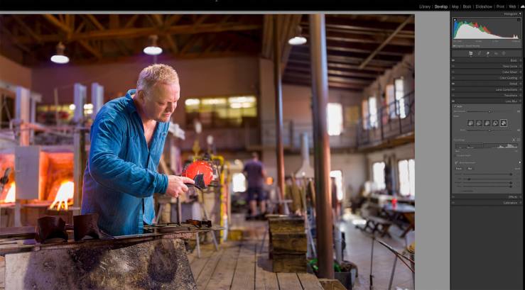 A Czech glass blower against an AI generated lens blur in Adobe Lightroom