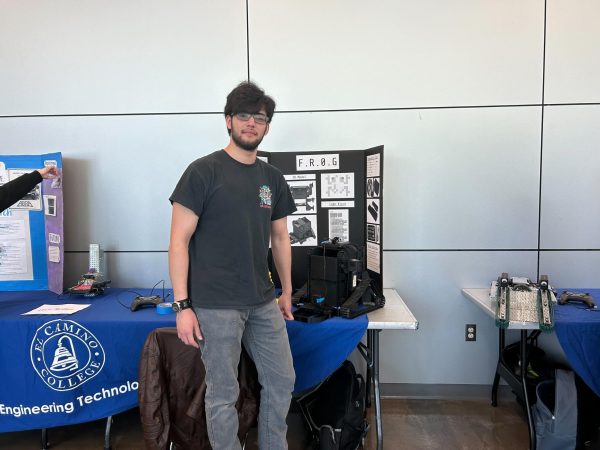 Robotics student Daniel Orozco and the robot that he created, giving him first place at the event. (Tommy Kallman | The Union)