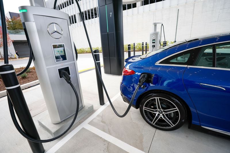 A Mercedes-Benz car is seen charging into the new EV charging station outside the Mercedes-Benz headquarters on Wednesday, Nov. 15, 2023. Mercedes-Benz introduced a groundbreaking electric vehicle (EV) fast-charging hub at its U.S. headquarters, marking the initiation of a plan to deploy 2,000 charging stations globally by the conclusion of 2024.Miguel Martinez /miguel.martinezjimenez@ajc.com