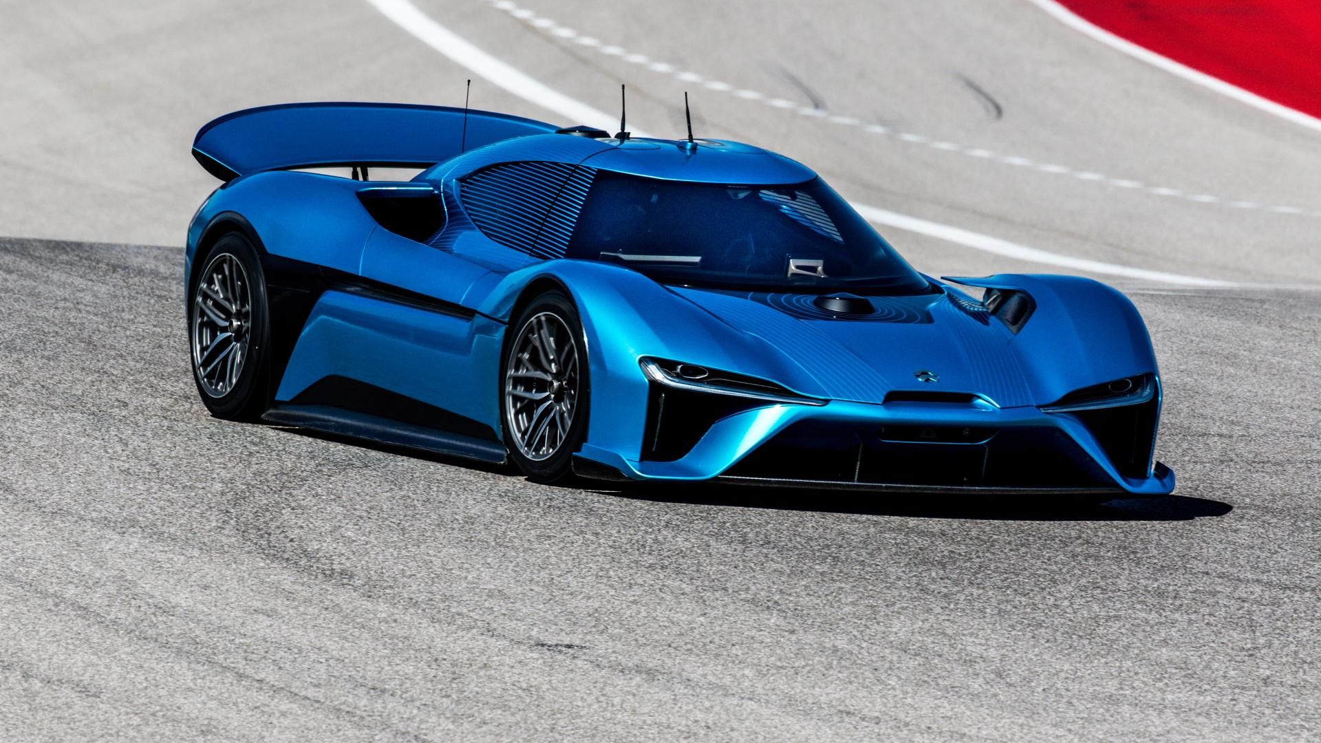 A blue NIO EP9 driving through the road course