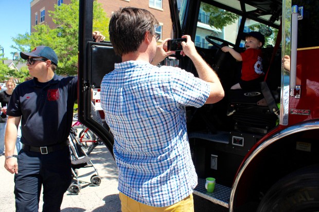 Kids had an opportunity to climb on firetrucks, meet first responders, and fill out a ballot for their favorite show car, for a chance to win a bike from Glenview Cycle during the Glenview Luxury Imports 3rd annual charity Exotic Car Show Sunday, a showcase of 58 of the rarest of automobiles in the world, in an event honoring our first responders. (Gina Grillo)