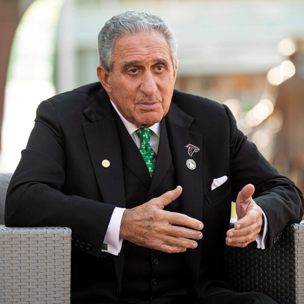 Arthur Blank gestures while speaking