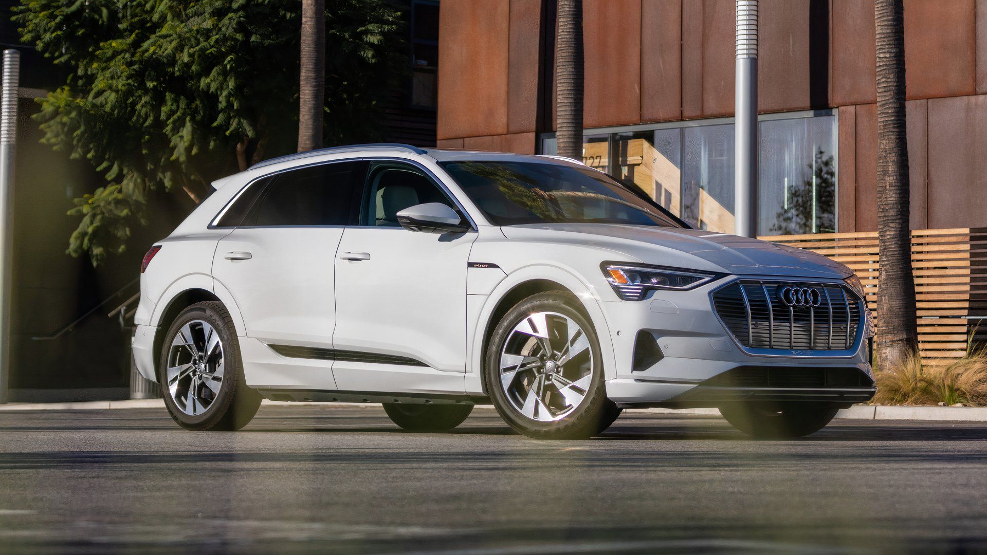 Front three quarters shot of a white Audi e-Tron SUV