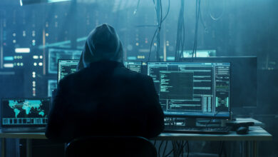 cybersecurity hacker in front of a computer.jpg