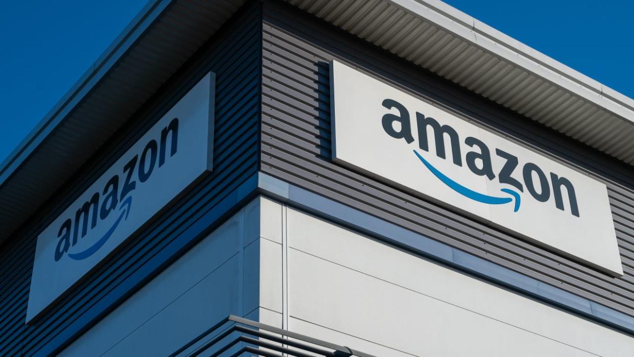 A general view of signage showing the Amazon logo on a warehouse on January 15, 2024 in Basildon, United Kingdom.