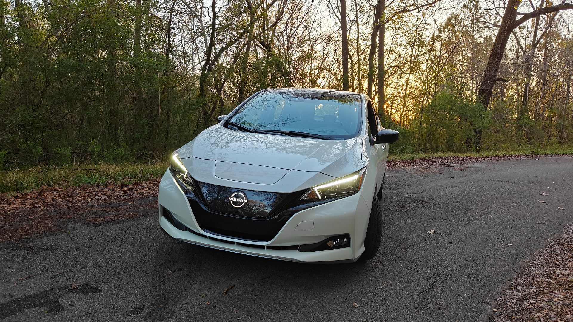 White 2024 Nissan Leaf near sunset