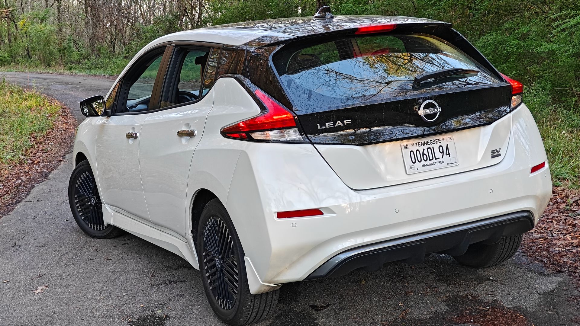 White 2024 Nissan Leaf on Desolate Road