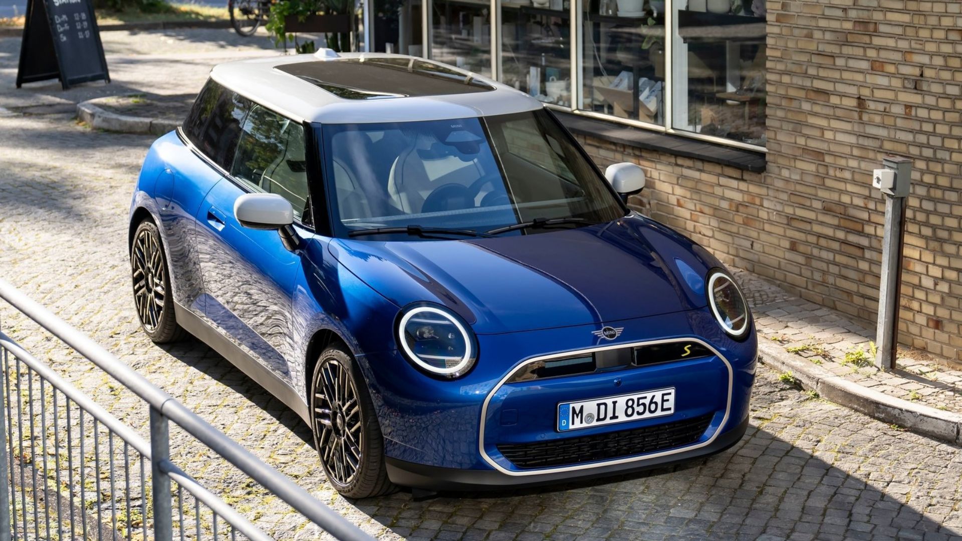 Blue 2024 Mini Cooper SE parked on street