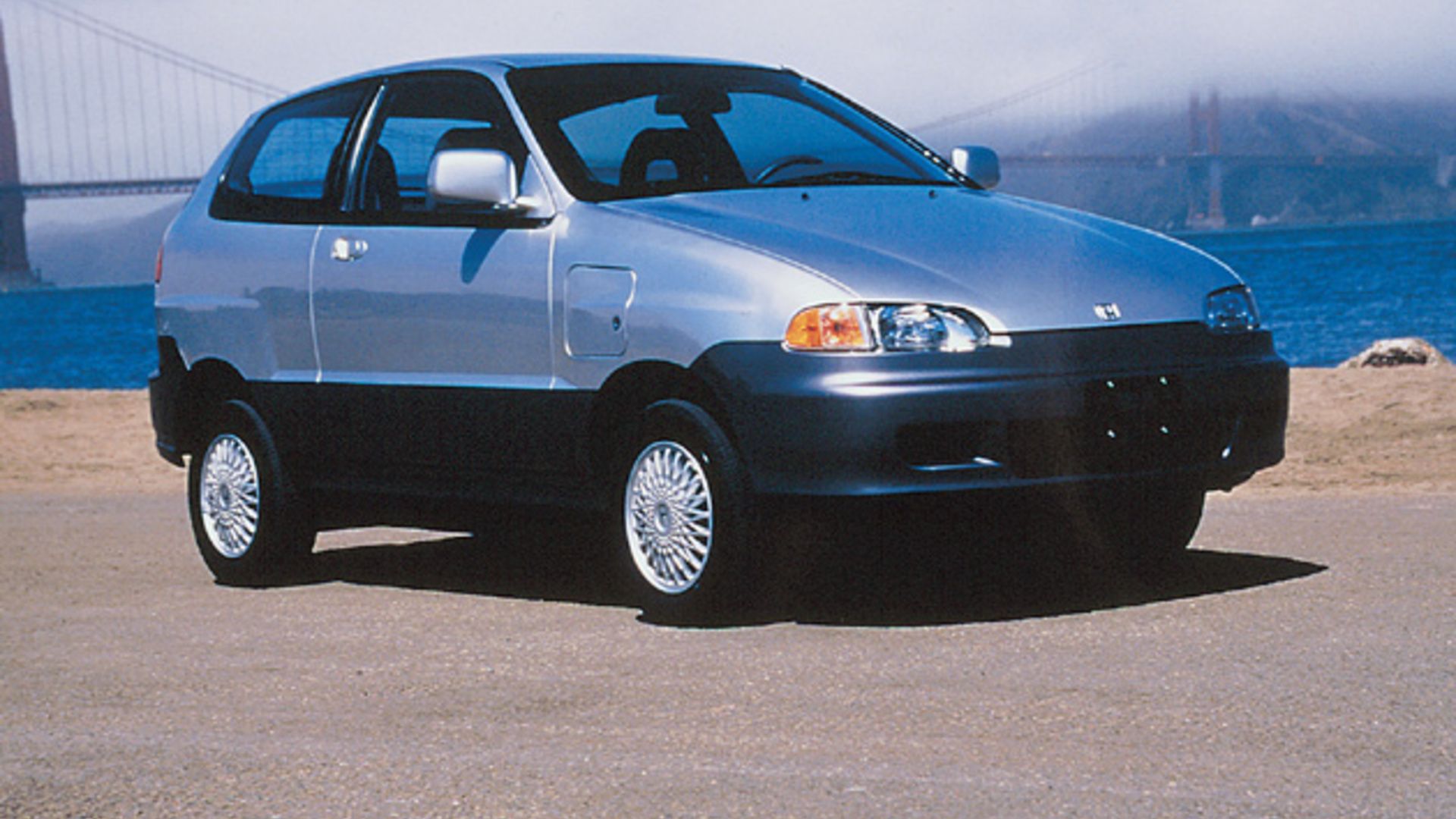 Gray Honda EV Plus sideview.