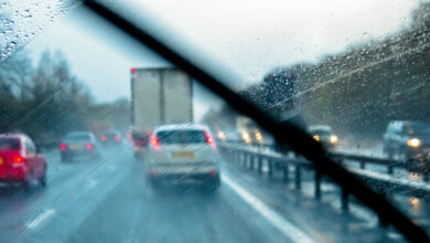 view behind windshield of a highway on a rainy day.jpg