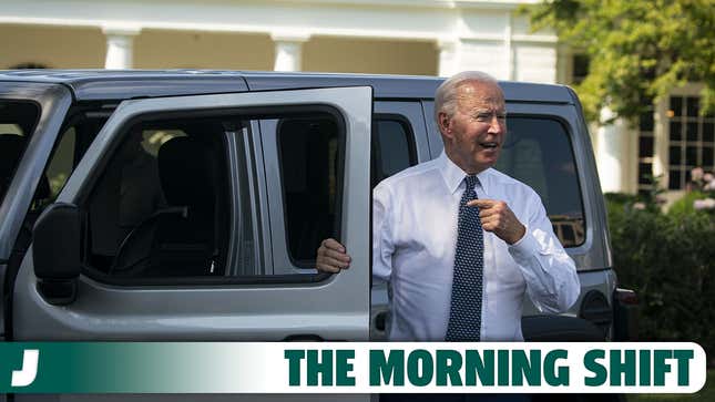 Joe Biden stands next to a Jeep Wrangler Rubicon 4xe