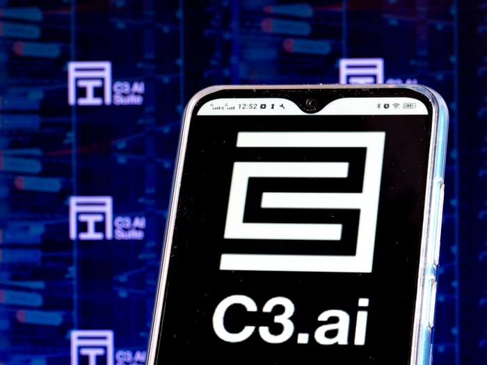 A smartphone with the C3ai logo on the screen.