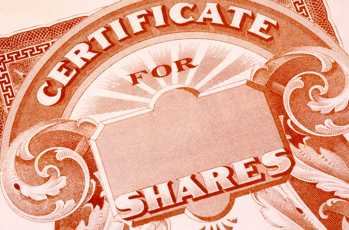 A paper stock certificate for shares of a publicly traded company. 