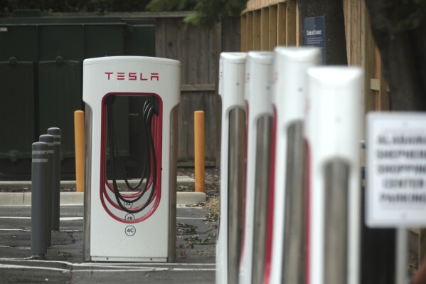 A Tesla supercharging location is seen on Kipling Street, June 3, 2024 in Houston. (AP Photo/Lekan Oyekanmi)