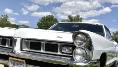 Making a beeline toward a 1965 Pontiac Grand Prix coupe